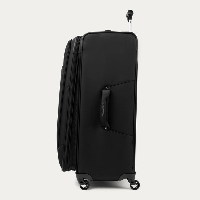 side profile view of the black travelpro maxlite 5 large check-in spinner showing the side carry handle, expansion zipper, and slim profile.