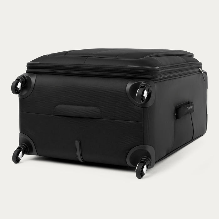 bottom and side view of the black travelpro maxlite 5 large check-in spinner showing the four 360 degree spinner wheels and the bottom molded handle cup for easy lifting.