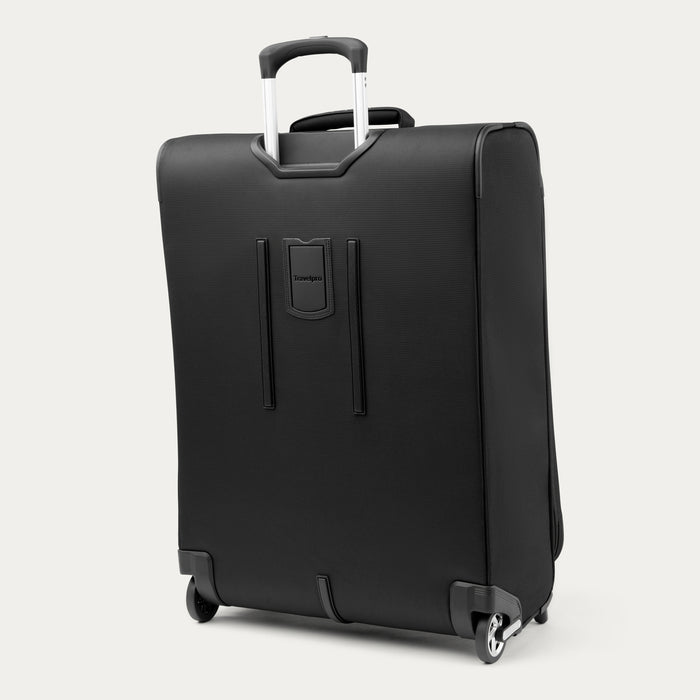 rear view of the black travelpro maxlite 5 medium check-in rollaboard suitcase showing the integrated rear stacking strap, high-performance ball-bearing wheels, and the fully extended powerscope lite handle.