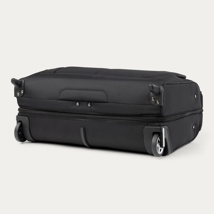 bottom view of the black travelpro maxlite 5 rolling carry on garment bag showing the durable ball bearing wheels, protective crash guards, and bottom stability foot.