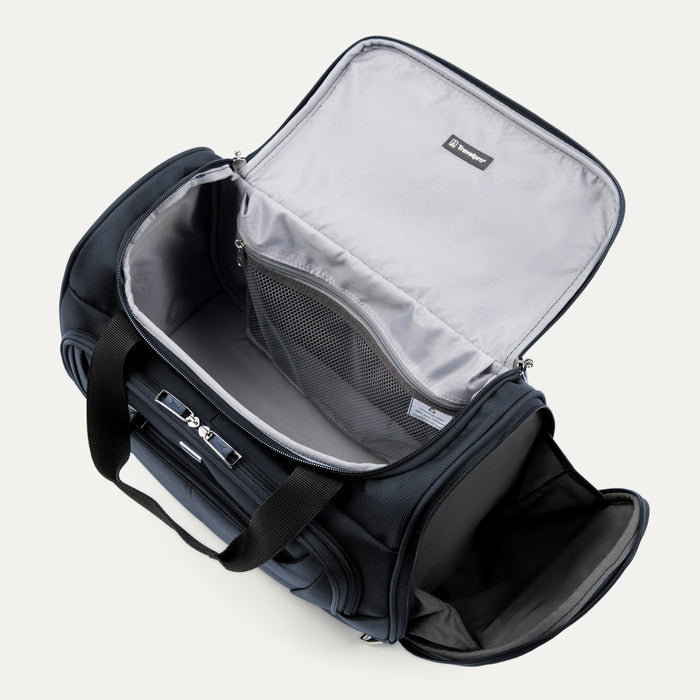 interior view of the open midnight blue travelpro maxlite 5 soft tote showing the spacious main compartment with gray ecofab lining and a large mesh zippered pocket under the lid.
