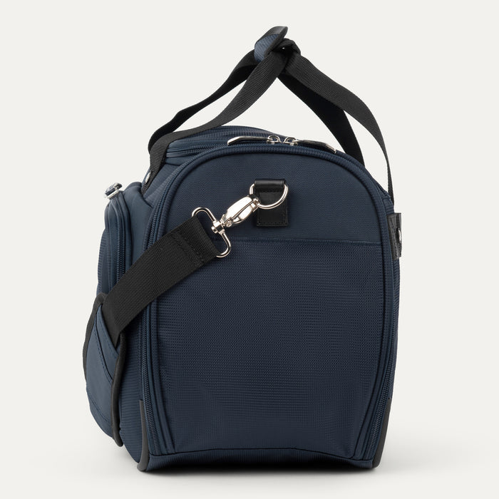 side view of the midnight blue travelpro maxlite 5 soft tote showing the adjustable shoulder strap attached to the metal d-ring and the exterior side pocket for quick access items.