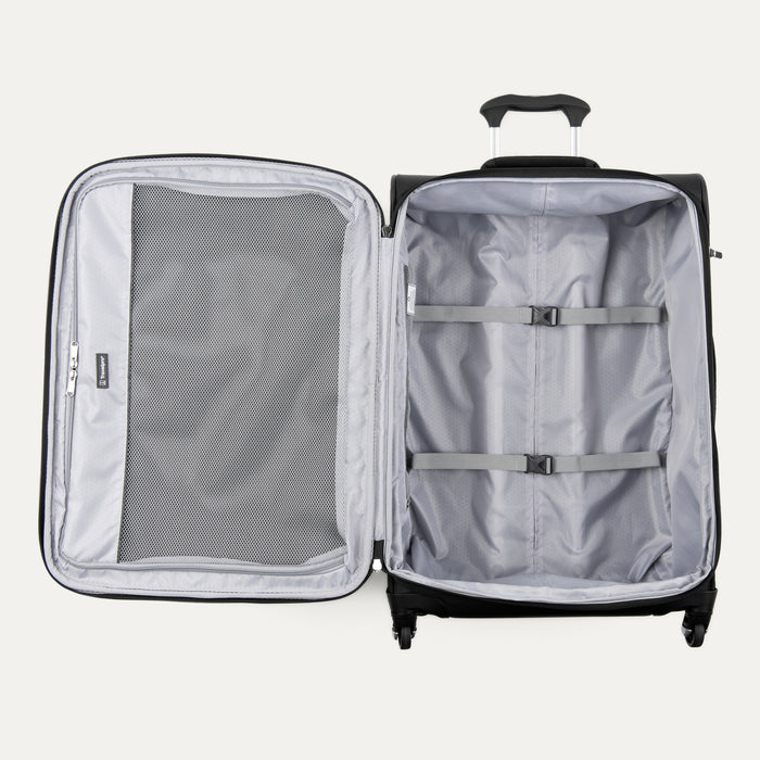 interior view of the open black travelpro maxlite 5 softside suitcase showing the large door-side mesh pocket and the main compartment with adjustable hold-down straps.