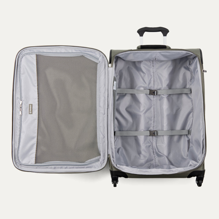 interior view of the open slate green travelpro maxlite 5 softside suitcase showing the large door-side mesh pocket and the main compartment with adjustable hold-down straps.