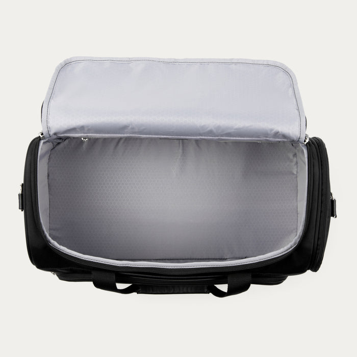 interior view of the open black travelpro maxlite 5 softside suitcase showing the large door-side mesh pocket and the main compartment with adjustable hold-down straps.