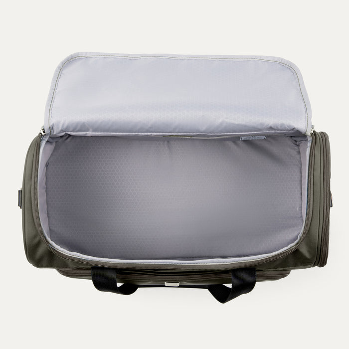 top interior view of the open slate green travelpro maxlite 5 drop bottom weekender showing the spacious main compartment with a light gray moisture-resistant lining.