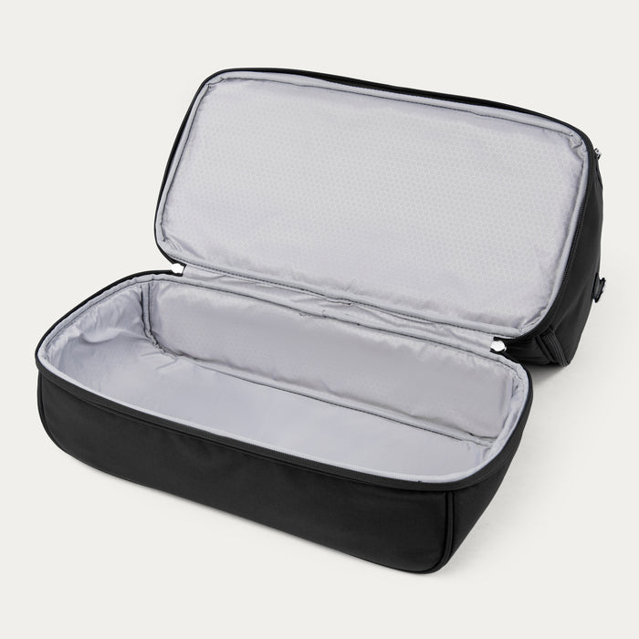interior view of the open drop-bottom compartment of the black travelpro maxlite 5 weekender bag showing the separate zippered section with a light gray water-resistant lining.