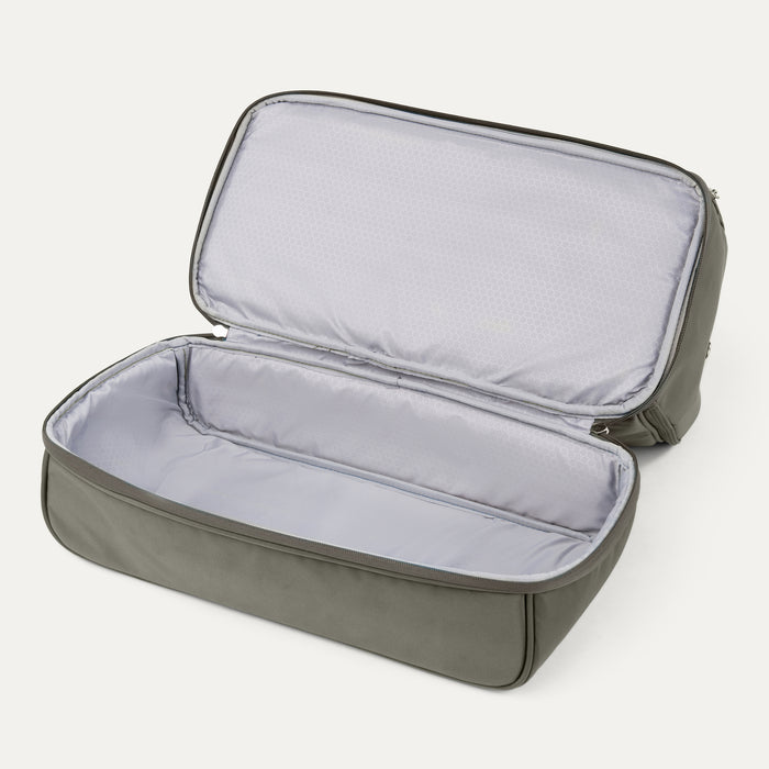 interior view of the open drop-bottom compartment of the slate green travelpro maxlite 5 weekender bag showing the separate zippered section with a light gray water-resistant lining.