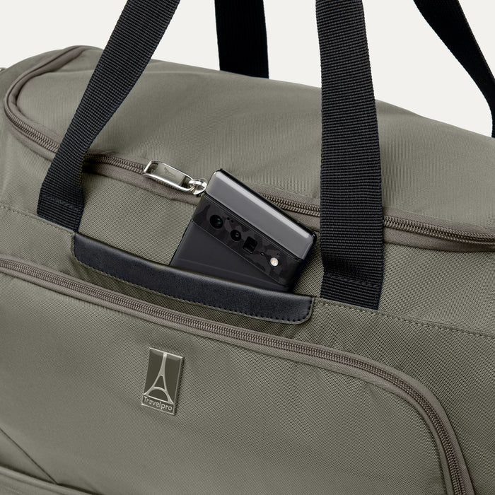 close up of the front zippered pocket on the slate green travelpro maxlite 5 weekender bag showing a smartphone tucked into the dedicated accessory sleeve.
