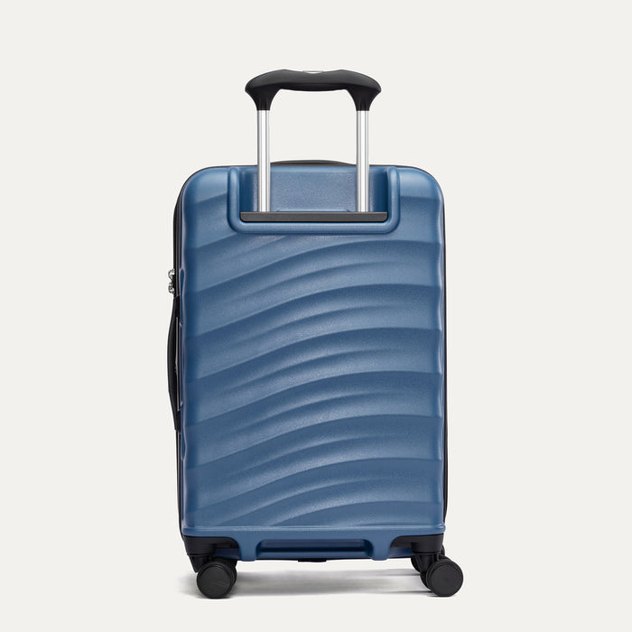 Rear view of Travelpro Maxlite Air V2 Spinner in Ensign Blue, showing the extended telescopic handle and side carry handle