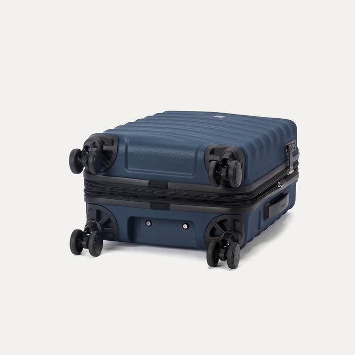 Bottom view of Travelpro Maxlite® Air V2 Carry-On Expandable Spinner in Midnight Blue, featuring 360° Spinner Wheels.