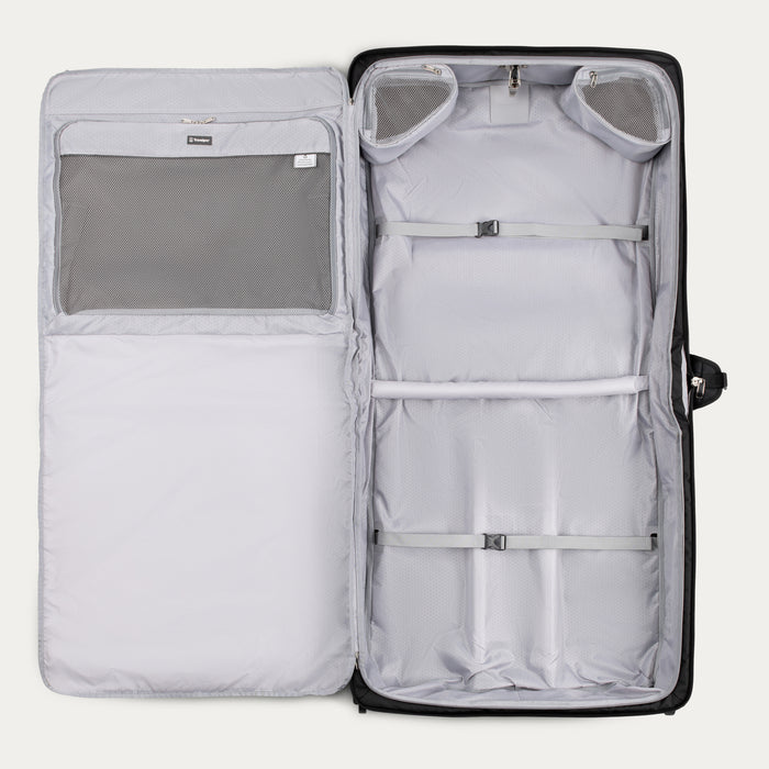 interior view of empty black travelpro maxlite checked rolling garment bag showing gray lining multiple mesh pockets and adjustable compression straps.