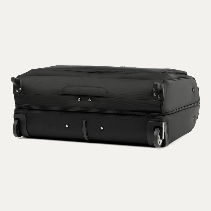 bottom view of black travelpro maxlite checked rolling garment bag showing high performance ball bearing wheels and molded corner guards.