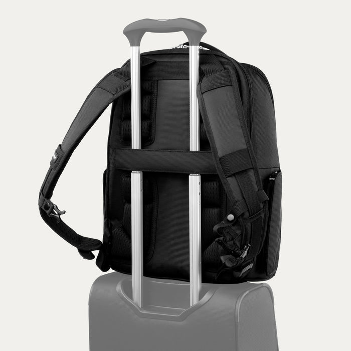 rear view of black travelpro maxlite laptop backpack showing the stacking strap secured over the telescoping handle of a suitcase.