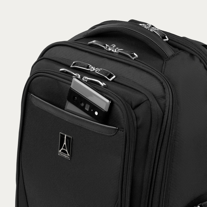 close up of black travelpro maxlite laptop backpack showing a smartphone being stored in the front quickslip pocket with magnetic closure.