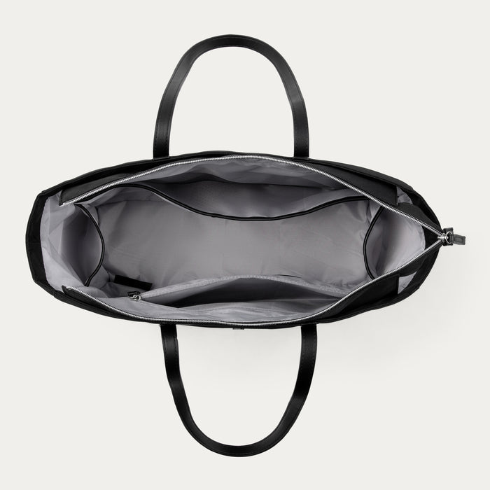 top down view of open black travelpro maxlite women's tote showing organized interior with multiple storage pockets and eco-friendly gray lining.