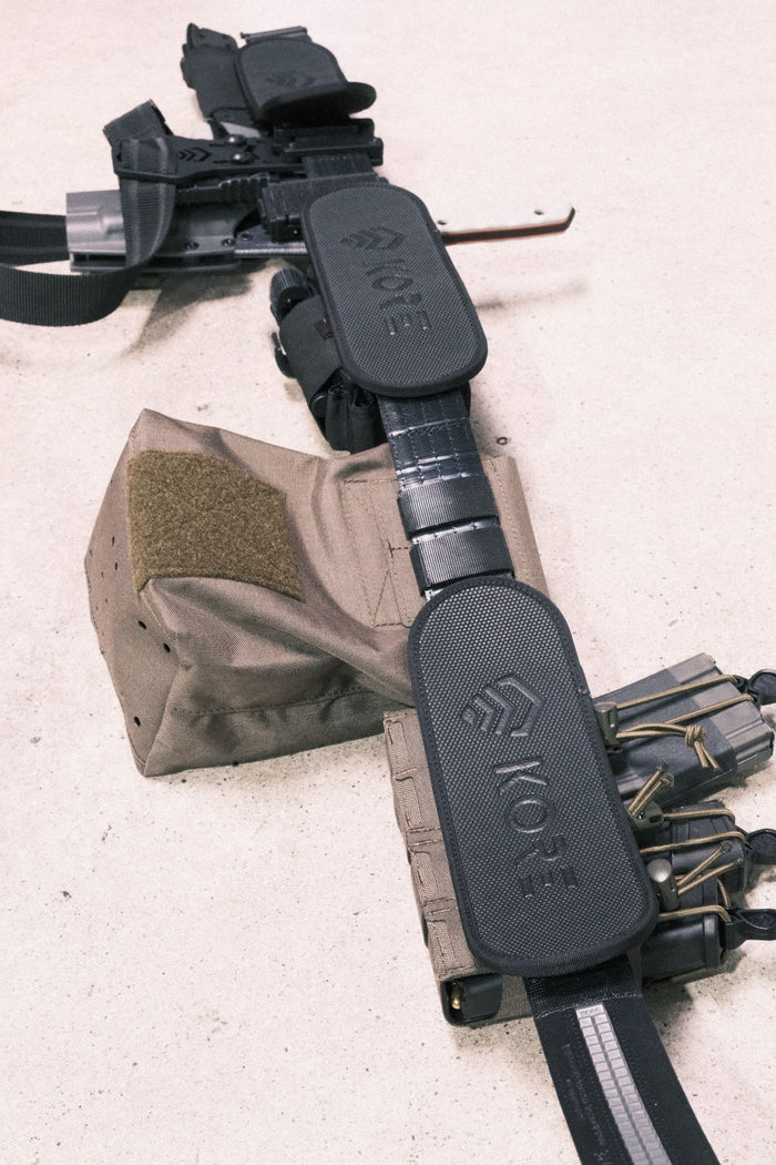 Kore Essentials Muffin Top Pads Attached to Inside of Kore Micro-Adjustable Molle Battle Belt Laid Flat on the Ground