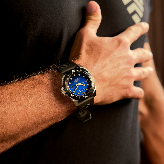 Closeup Shot of Man Resting Kore Essentials Oceanic Field Watch on His Chest
