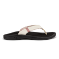 White and black thong sandal with cushioned sole and textured upper strap detail.