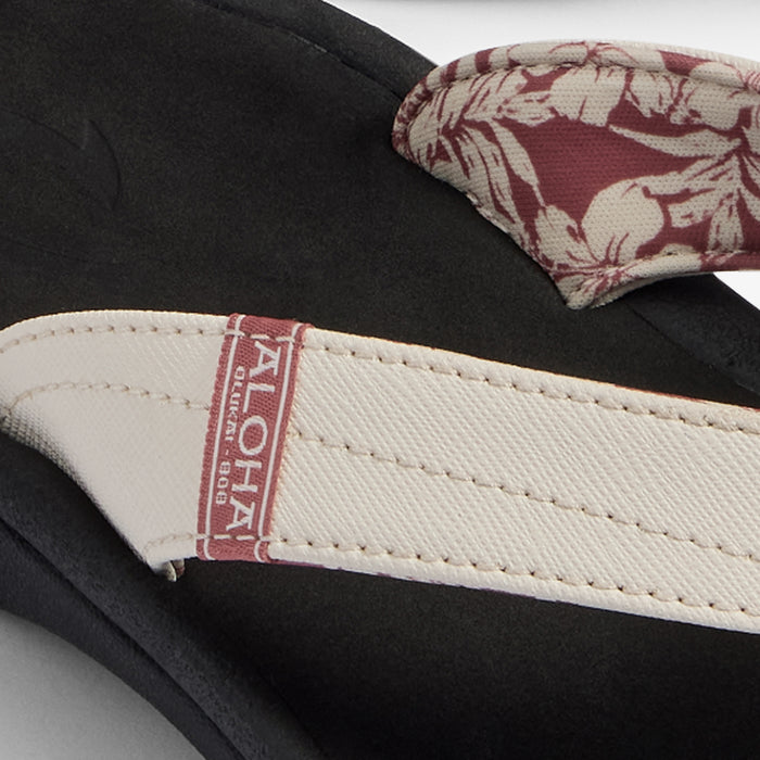 White sand and onyx slide sandal with red patterned fabric upper and woven label detail.