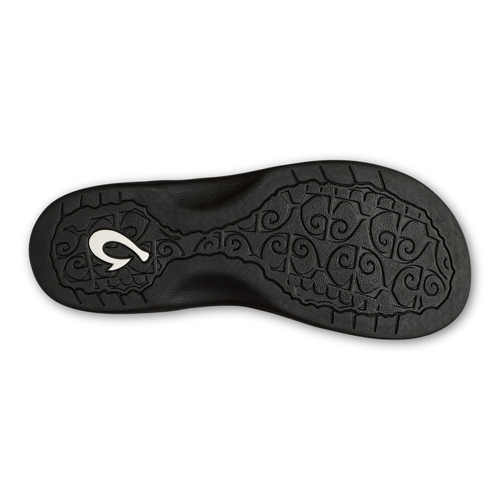 Black sole with white logo and ornamental tread pattern.