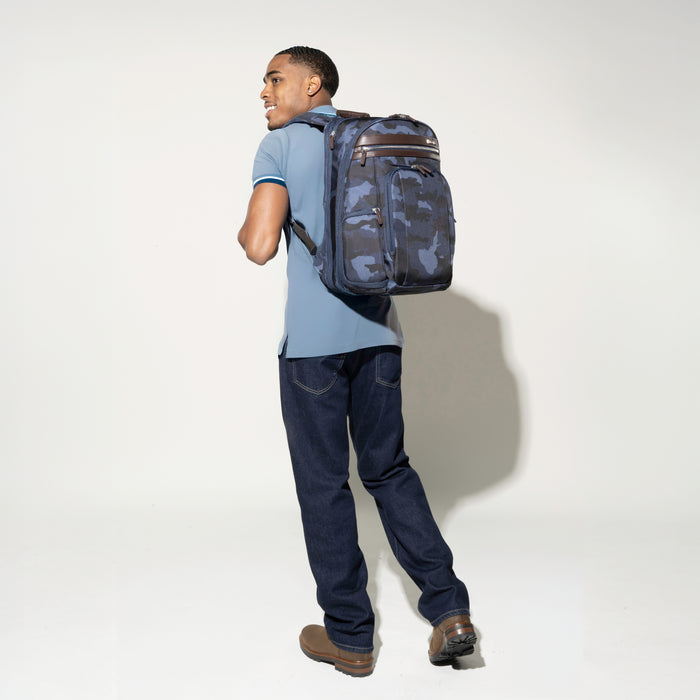 Man carrying the Platinum® Elite Business Backpack in Camouflage