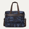 Front view of Travelpro Platinum Elite Drop-Bottom Weekender in Navy Camouflage with dual carry handles and zippered front pocket.