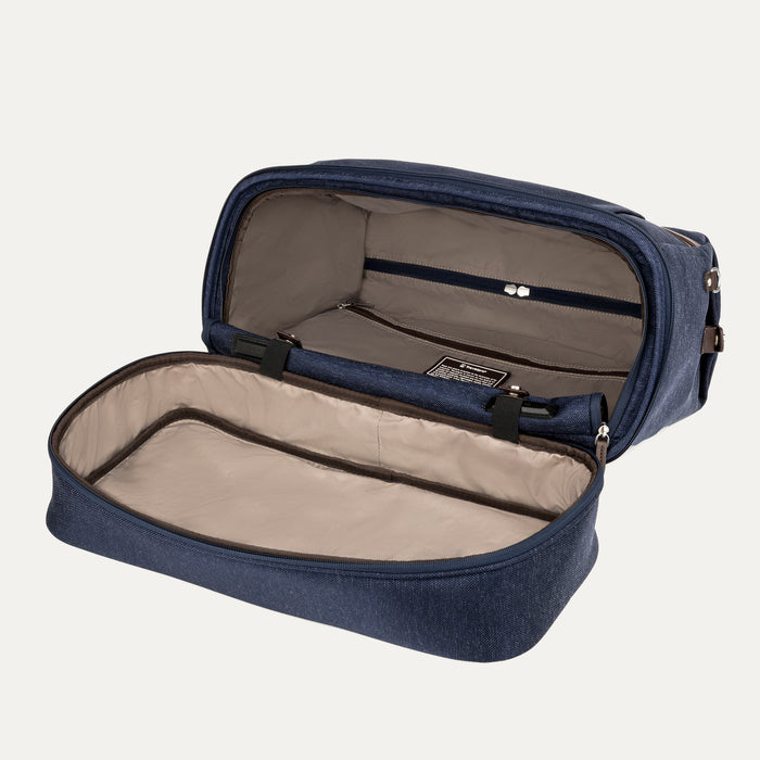 fully opened main compartment of the true navy travelpro platinum elite weekender bag, showing the spacious interior with a light tan lining and a large zippered pocket for organized packing.