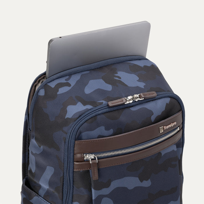 Close-up view of Travelpro Platinum Elite Slim Backpack in Navy Camouflage with laptop in padded laptop sleeve.