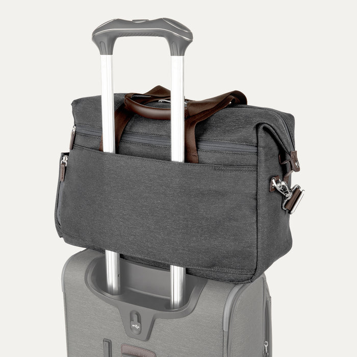 Rear view of the Travelpro Platinum Elite Soft Duffel in Vintage Grey, showing back sleeve secured over telescoping suitcase handle, brown leather trim, and silver hardware against a white background.