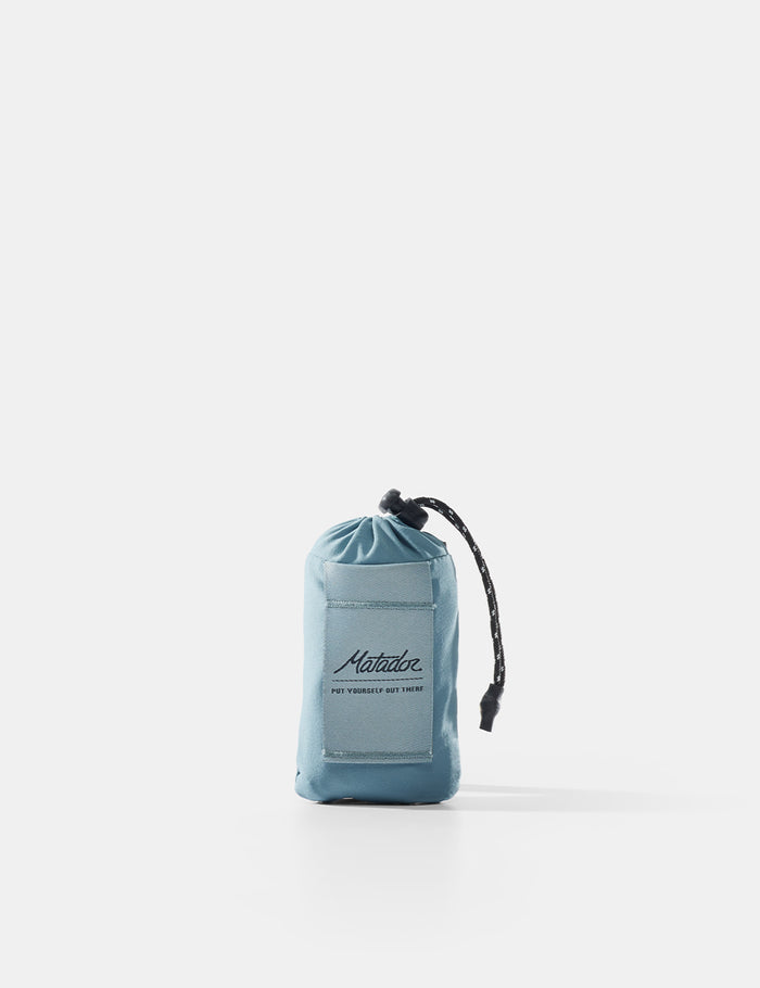 Blue drawstring pouch with brand logo on a white background