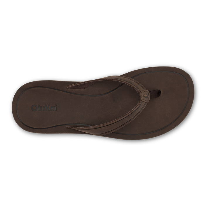 Dark brown leather thong sandal with curved straps and embossed OluKai branding on sole.