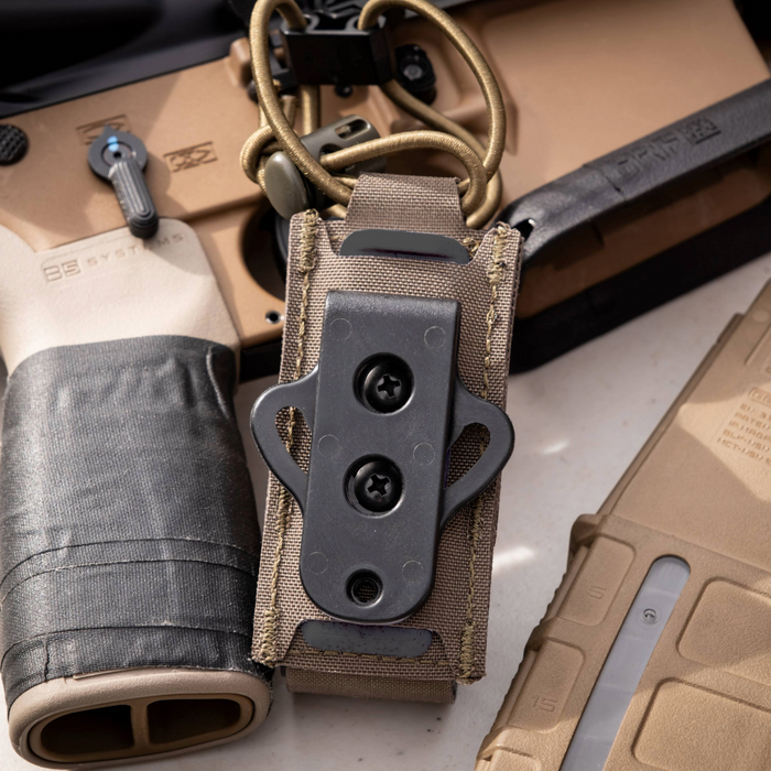 Close-up of Kore Essentials single pistol mag pouch with a Swinger Mount attached to the back