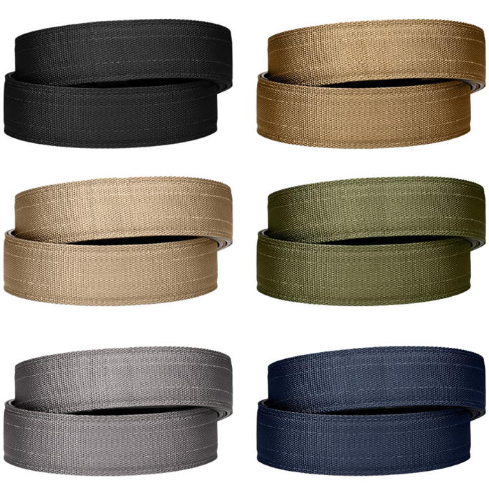 A collection of six different Kore Essentials tactical nylon gun belt straps. Featured is one black, coyote, tan 499, ranger green, gray, and navy nylon gun belt strap.