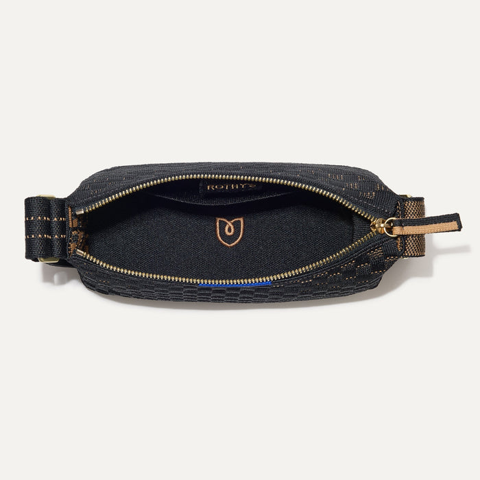 The Casual Crossbody in Night Song, shown from above, with the interior exposed.