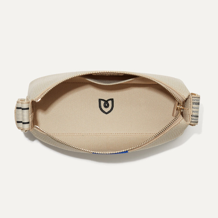 The Casual Crossbody in Parchment, shown from above, with the interior exposed.