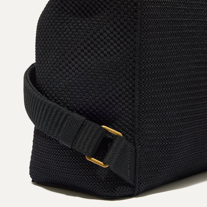 Closer look at the side straps of The Cinch Back Pack in Black.