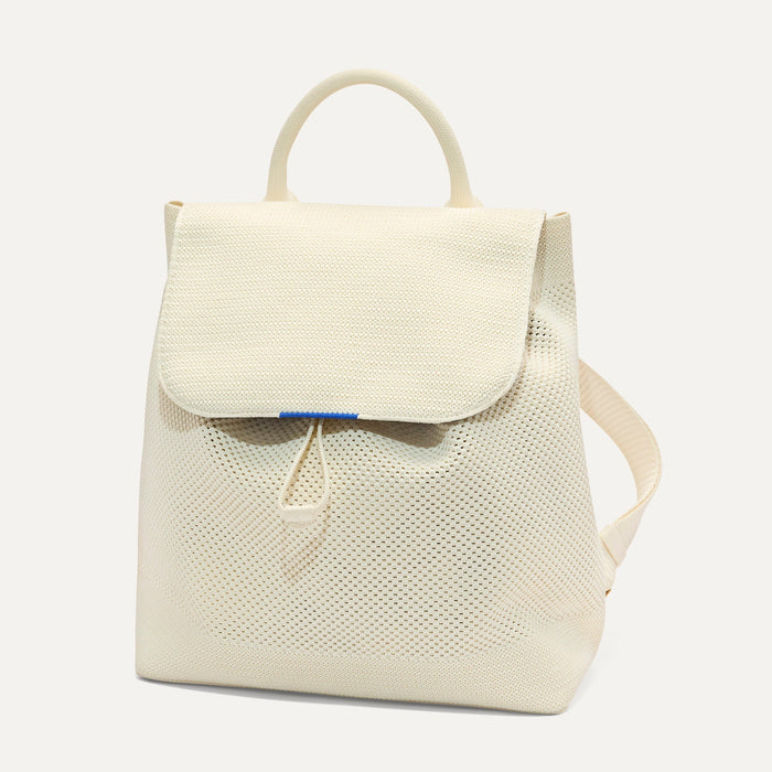 PDP | The Cinch Backpack in Coconut Crochet shown from the front.