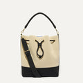 PLP |The Cinch Bucket Bag in Black and White Raffia-Knit shown from the front.