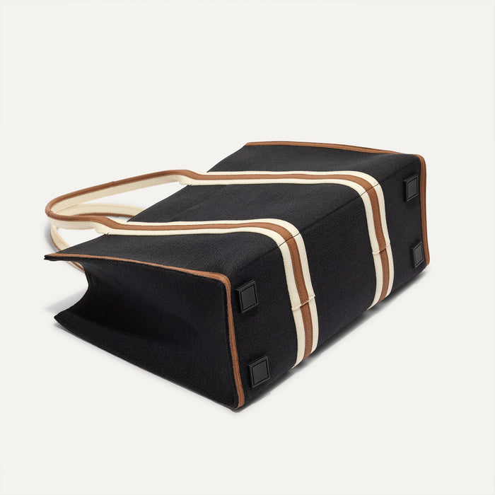 The Classic Tote in Black Coffee, shown from the bottom.