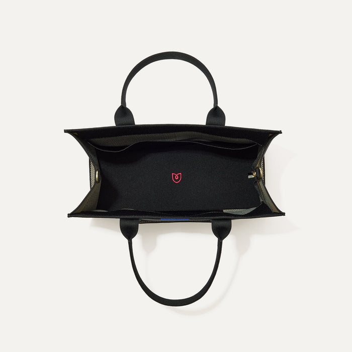 The Classic Tote in Black Herringbone, shown from above, with the interior exposed.