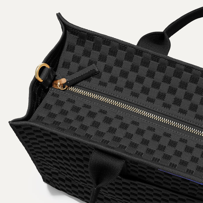 The Classic Tote in Black Sand, shown from above, with the top zipper closed.