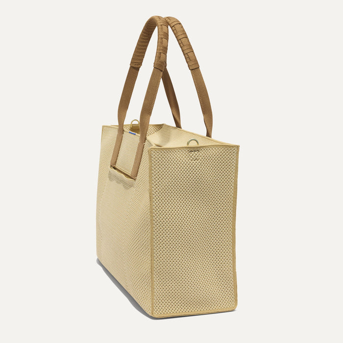 The Classic Tote in Macadamia Open-Knit, shown from the side.