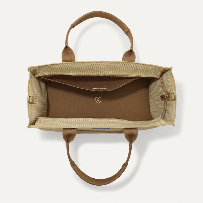The Classic Tote in Macadamia Open-Knit, shown from above, with the interior exposed.