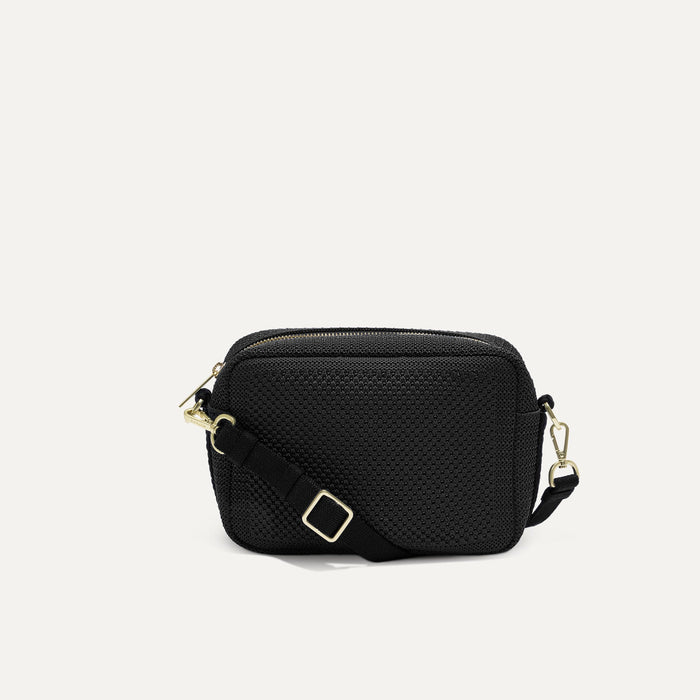 PLP |The Crossbody Camera Bag in  Black Licorice Open-Knit, shown from the front.