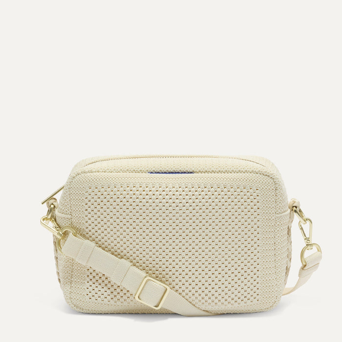 PDP |The Crossbody Camera Bag in  Cream Twist Open-Knit, shown from the front.