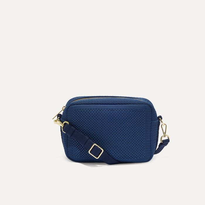 PLP |The Crossbody Camera Bag in  Lagoon Open-Knit, shown from the front.