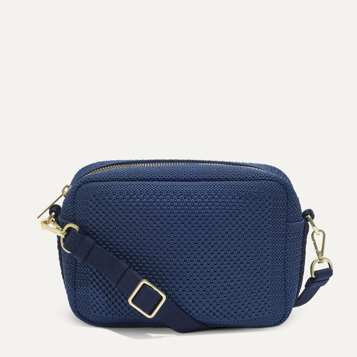PDP |The Crossbody Camera Bag in  Lagoon Open-Knit, shown from the front.