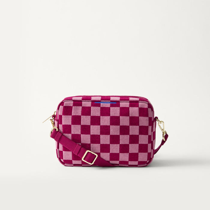 EXT | The Crossbody Camera Bag in  ReVelvet™ Orchid, shown from the front.