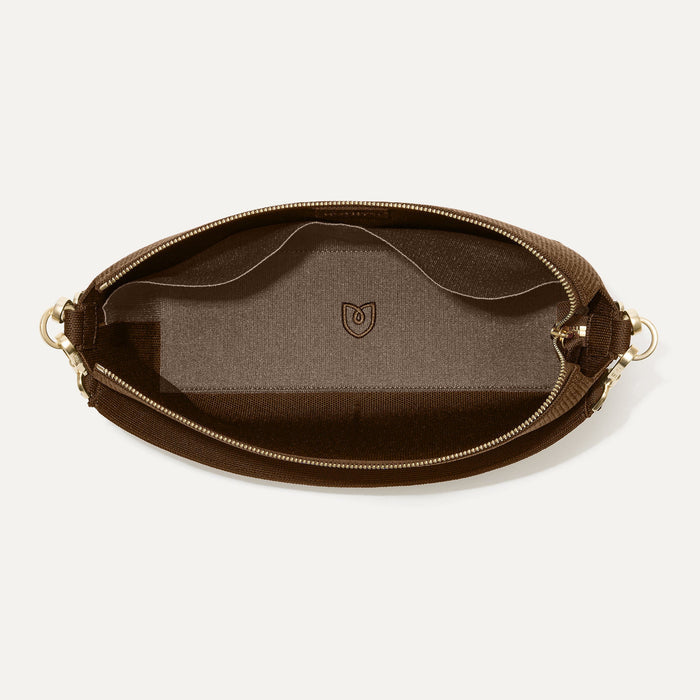 The Daily Crossbody in Revelvet™ Cinnamon shown from the top down, with zipper open and interior exposed.
